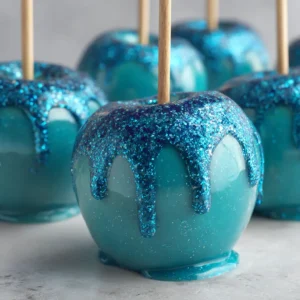 Ocean Candy Apples (The Ultimate Guide) 4 A close-up of a blue candy apple, highlighting the glossy, smooth texture of the hard candy coating.