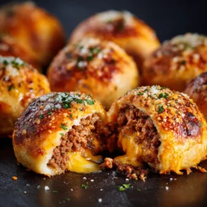 Garlic Parmesan Cheeseburger Bombs: The Ultimate Guide 4 A close-up view of a baked cheeseburger bomb with a golden garlic parmesan crust, highlighting its savory texture.